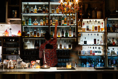 Join a hidden bar tour with a group of friends. 