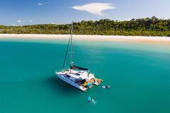 A Whitsunday Islands Sail, SUP & Snorkel Day Tour. Book your tour with Sightseeing Pass Australia