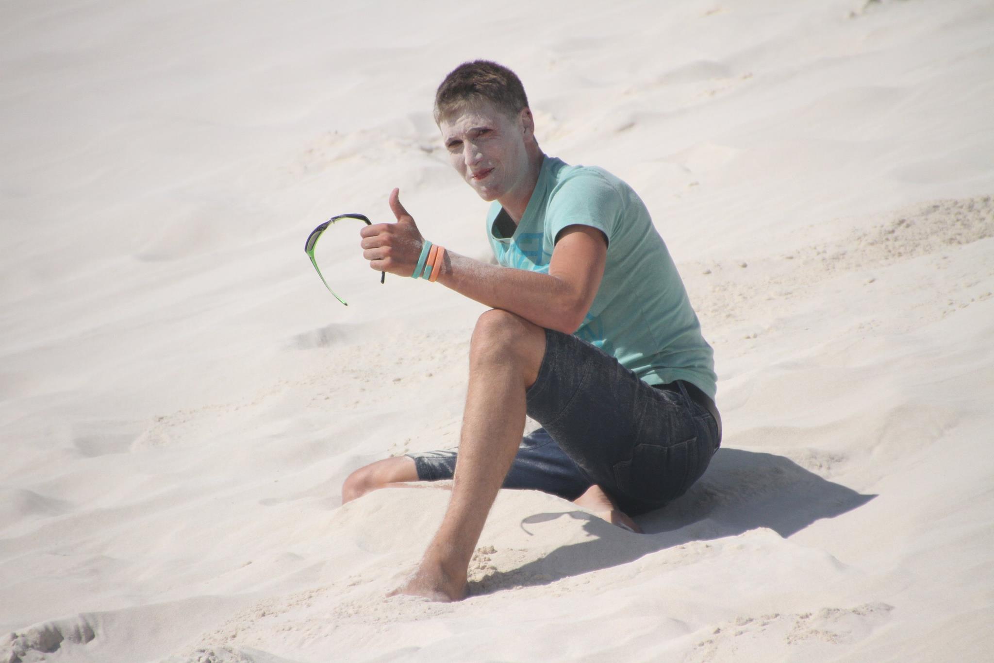 Explore the Pinnacles Desert and go sandboarding on the white sand dunes